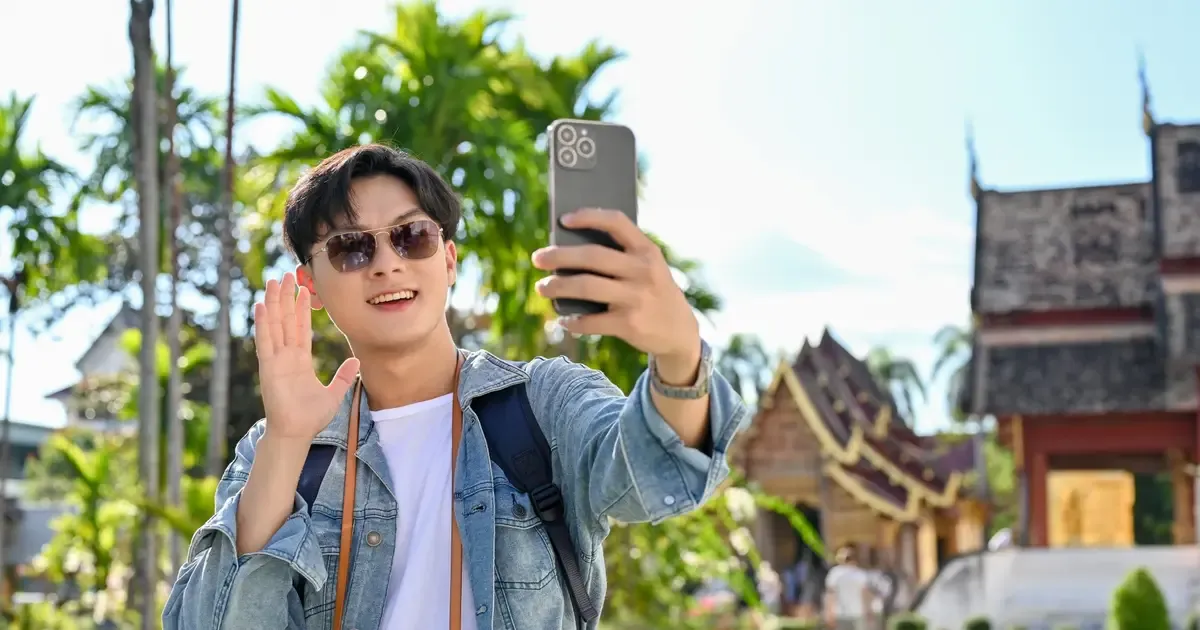 Traveler buying a local SIM card at a Laos airport arrivals counter